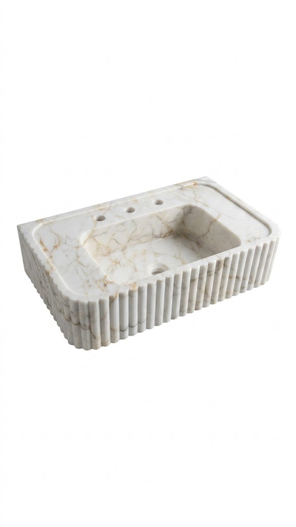 Rectangular marble sink with decorative ribbed edge on a white background